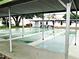 Community shuffleboard courts under a covered structure for recreational use at 4154 57Th N St # 272, Kenneth City, FL 33709