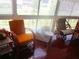 Relaxing sunroom with rattan chairs, a glass table, and views of the outdoors at 4154 57Th N St # 272, Kenneth City, FL 33709
