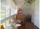 Bright sunroom with large windows, comfortable seating, and a dining area at 4154 57Th N St # 272, Kenneth City, FL 33709