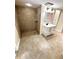 Bathroom featuring a standalone vanity with drawers and a tile walk-in shower with a showerhead at 5552 Pentail Cir, Tampa, FL 33625