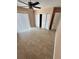 Bedroom featuring tile floors, ceiling fan, and closet space at 5552 Pentail Cir, Tampa, FL 33625