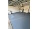 Garage featuring painted floors, washer and dryer, and storage at 5552 Pentail Cir, Tampa, FL 33625