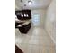 Bright kitchen with granite countertops, stainless appliances, and adjacent outdoor access at 5552 Pentail Cir, Tampa, FL 33625