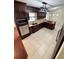 Modern kitchen featuring custom cabinetry, granite countertops, and stainless steel appliances at 5552 Pentail Cir, Tampa, FL 33625