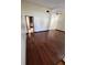 Open-concept living room with hardwood floors and vaulted ceilings, offering a bright and airy feel at 5552 Pentail Cir, Tampa, FL 33625