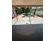 Backyard with a kidney shaped pool and a screened in patio at 5552 Pentail Cir, Tampa, FL 33625