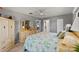 Cozy bedroom featuring a dresser with vanity and decor at 567 Whippoorwill Dr, Venice, FL 34293