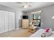 This bedroom includes a closet, window, and natural-wood furnishings, perfect for a serene and restful experience at 567 Whippoorwill Dr, Venice, FL 34293