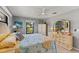 Comfortable bedroom with gray walls and view to exterior at 567 Whippoorwill Dr, Venice, FL 34293