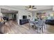 Open concept dining room with hardwood floors and neutral colors at 567 Whippoorwill Dr, Venice, FL 34293