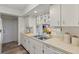 Functional kitchen featuring white cabinetry, modern appliances, and a convenient layout at 567 Whippoorwill Dr, Venice, FL 34293