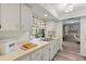 Bright kitchen area with ample counter space and a view into the adjacent living area at 567 Whippoorwill Dr, Venice, FL 34293