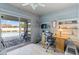 Comfortable office with built in shelves desk and view and direct access to the backyard pool area at 567 Whippoorwill Dr, Venice, FL 34293