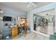 Comfortable office with built in shelves desk and view and direct access to the dining area at 567 Whippoorwill Dr, Venice, FL 34293