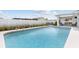 Large pool in the backyard area surrounded by a deck and patio areas at 567 Whippoorwill Dr, Venice, FL 34293