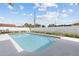 Backyard pool with concrete patio, fenced-in perimeter, and landscaped yard at 567 Whippoorwill Dr, Venice, FL 34293
