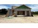 An up-close construction of a modern home showing the block and ZIP System sheathing in the framing process at 7930 Chandler Lake Ct, Hudson, FL 34667