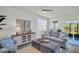 Cozy living room with stylish furniture, elegant decor, and plenty of natural light at 13964 Emerald Fields Dr, Hudson, FL 34667
