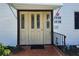 Apartment entrance featuring triple doors, brick entryway, awning, and address numbers at 22481 Westchester Blvd # A19, Punta Gorda, FL 33980