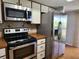 Kitchen featuring stainless steel appliances and ample cabinet space at 22481 Westchester Blvd # A19, Punta Gorda, FL 33980