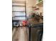 Well-equipped laundry area with newer washer and dryer, lots of shelving, and durable plank flooring at 22481 Westchester Blvd # A19, Punta Gorda, FL 33980