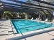 Enjoy the community's large, pristine screened-in pool with plenty of lounge seating for residents at 22481 Westchester Blvd # A19, Punta Gorda, FL 33980
