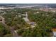High angle aerial shot overlooking a secluded home, ponds, and surrounding neighborhoods at 233 Snyder Dr, Venice, FL 34292