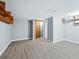 Spacious basement with modern flooring, shelving, and closet space for ample storage at 233 Snyder Dr, Venice, FL 34292