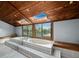 Soaking tub with skylights and wooded views in the bathroom at 233 Snyder Dr, Venice, FL 34292