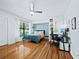Spacious bedroom with modern ceiling fan and hardwood flooring throughout at 233 Snyder Dr, Venice, FL 34292