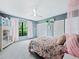 Bedroom featuring neutral walls, ceiling fan, and large closet at 233 Snyder Dr, Venice, FL 34292