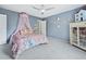 Bedroom features neutral walls, ceiling fan, and large closet at 233 Snyder Dr, Venice, FL 34292