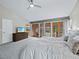 Spacious main bedroom with vaulted ceiling, large windows, and private access to the patio at 233 Snyder Dr, Venice, FL 34292
