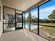 Screened-in patio with a view of a beautiful pool and landscaping. Great for relaxing and entertaining at 233 Snyder Dr, Venice, FL 34292
