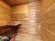 Cozy cedar sauna featuring a wooden bench seat and rustic charm at 233 Snyder Dr, Venice, FL 34292