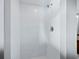 Bright white tiled shower stall with modern fixtures and clean lines at 233 Snyder Dr, Venice, FL 34292