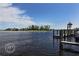 Scenic waterfront view with docks and 'Crow's Nest' sign, showing the beautiful coastal surroundings at 233 Snyder Dr, Venice, FL 34292