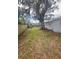A view of the backyard of the home with a trailer at 4934 Avery Rd, New Port Richey, FL 34652