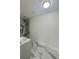 Bathroom featuring a gray vanity and modern gray flooring with white accents at 4934 Avery Rd, New Port Richey, FL 34652