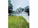 A well-kept single-story home with a white garage door and a neatly trimmed lawn at 4934 Avery Rd, New Port Richey, FL 34652
