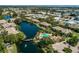 Aerial view showing community features including a lake and pool at 10263 Gandy N Blvd # 203, St Petersburg, FL 33702