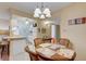 Charming dining area with a round table and four chairs near kitchen at 219 S Mcmullen Booth Rd # 175, Clearwater, FL 33759