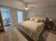Spacious Primary bedroom with king bed and ensuite bathroom access at 975 Coronado Dr, Punta Gorda, FL 33950