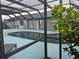 Relaxing pool and patio area with screened enclosure at 975 Coronado Dr, Punta Gorda, FL 33950
