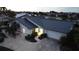 Single-story home with a metal roof and landscaped yard at 975 Coronado Dr, Punta Gorda, FL 33950