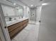 Modern bathroom with double vanity, large mirror, and walk-in shower at 975 Coronado Dr, Punta Gorda, FL 33950