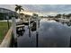 Peaceful canal-front view with private dock and boats at 975 Coronado Dr, Punta Gorda, FL 33950