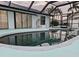 Relaxing kidney-shaped pool with a screened patio and lounge chairs at 975 Coronado Dr, Punta Gorda, FL 33950