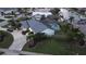 Single-story home with metal roof, pool, and canal view at 975 Coronado Dr, Punta Gorda, FL 33950
