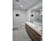 Elegant bathroom with double vanity, updated fixtures, and a toilet at 975 Coronado Dr, Punta Gorda, FL 33950